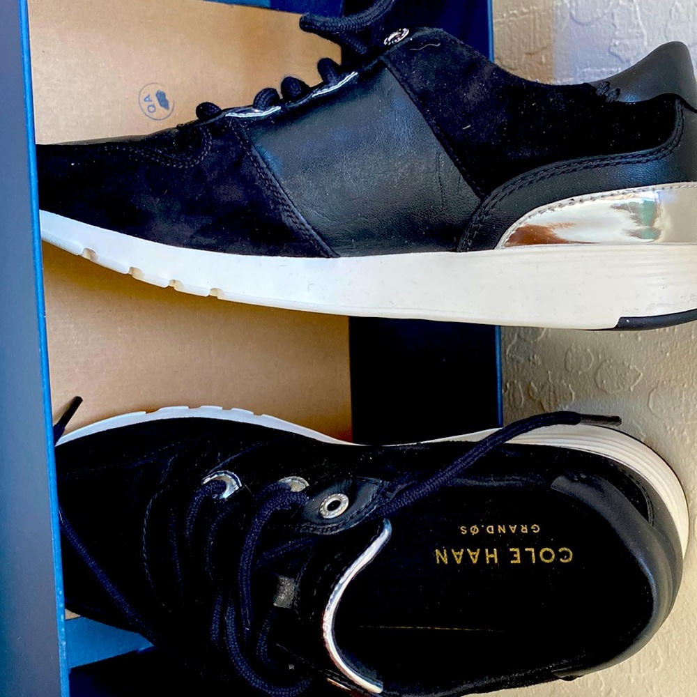 Cole Haan Suede and leather lace up tennis shoes.